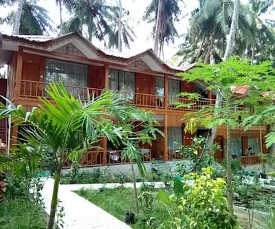 https://imgcld.yatra.com/ytimages/image/upload/t_hotel_yatra_city_desktop/v1524543680/Hotel/Havelock Island/00022924/DELUXE_COTTAGES_EXTERIOR_CmvGPo.jpg